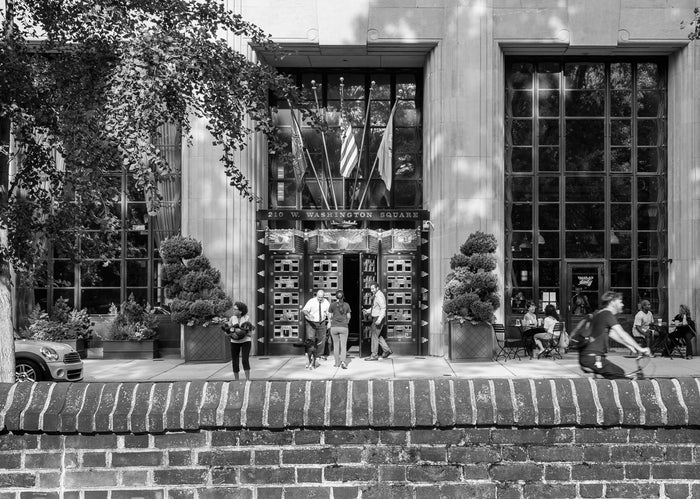 "West Washington Square, Philadelphia" by James Abbott. An Inkjet Print depicting people entering and passing by the entrance to 210 W Washington Square from inside the Square. Cityscape, Landscape, Pedestrians, Black and White, Photograph. The Print Center