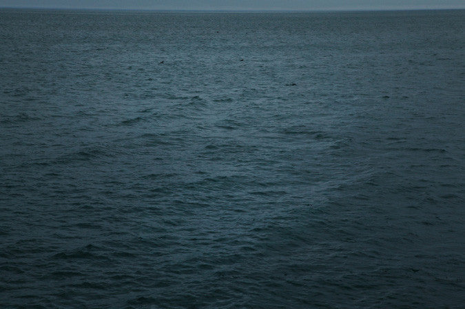 "Steerage" an Inkjet Print by Rachel Beamer. Depicts a writhing teal blue ocean. Color Photography, water, nature, landscape, seascape, waves, moody. The Print Center