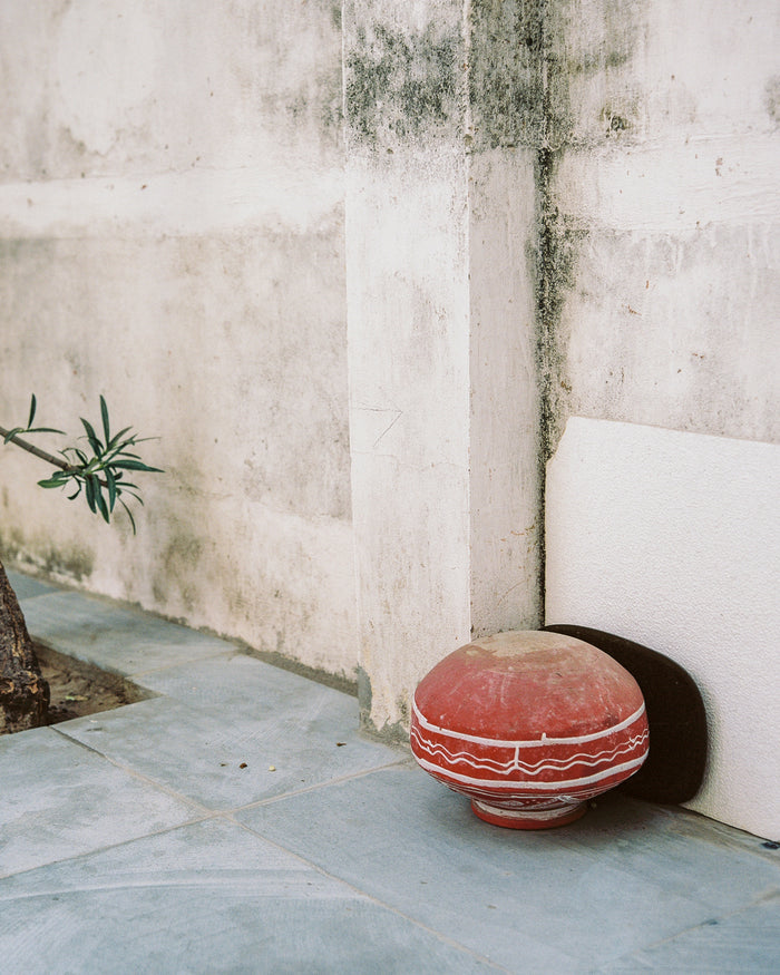"Matki" an Inkjet Print by  Saleem Ahmed. red Pottery, concrete, buildings, Trees, Blue tiles. The Print Center