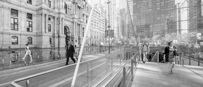 "Southwest Transit Exit in AM, Dilworth Park, Philadelphia" by James Abbott. An Inkjet Print depicting passengers exiting from the subway station underneath Philadelphia's City Hall. Landscape, Cityscape, Black and White, Photograph, Rush hour. The Print Center